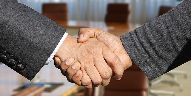 Shaking hands agreement business press release